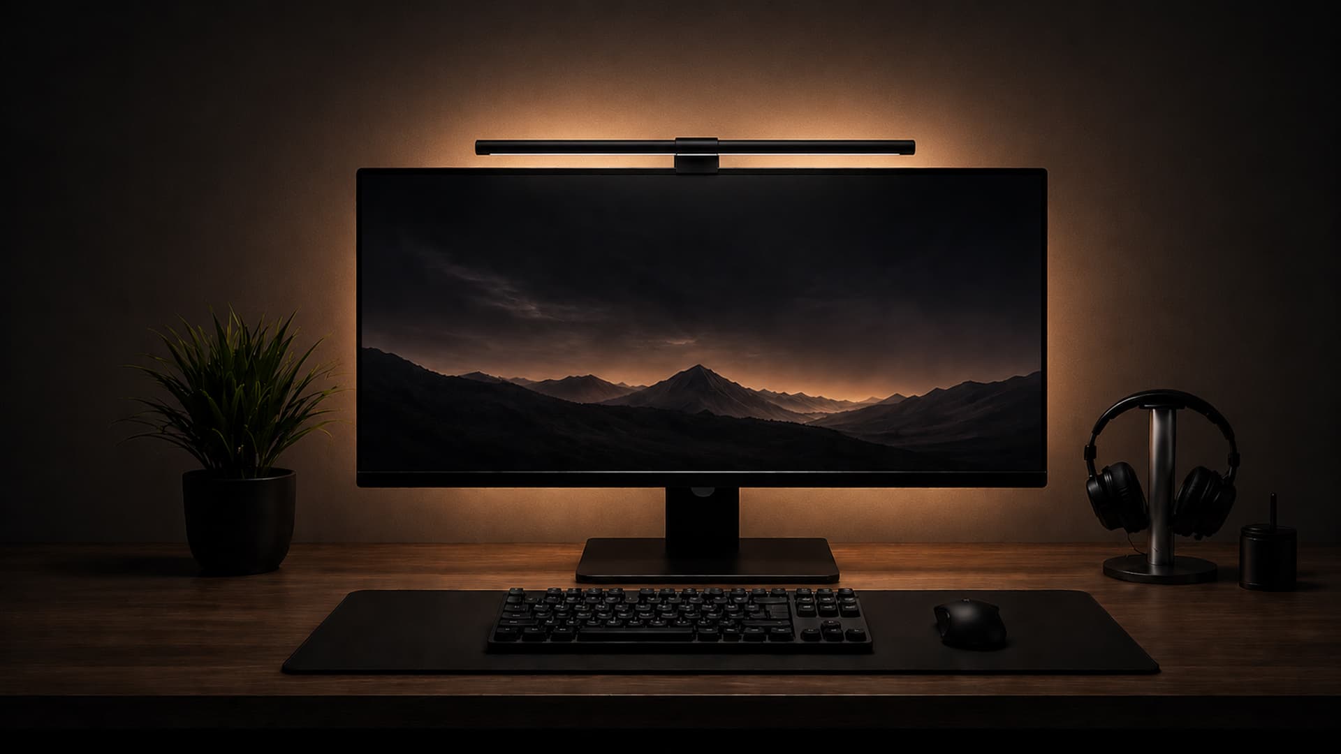 A desk lit by the DeskGlow monitor light bar — warm, glare-free light