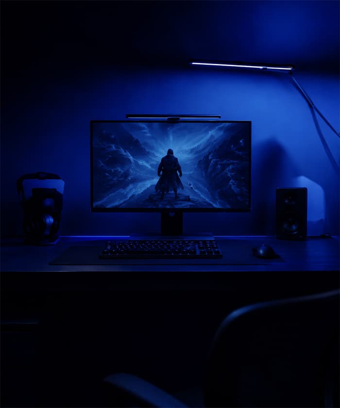 Gamer desk setup lit by a DeskGlow monitor light bar